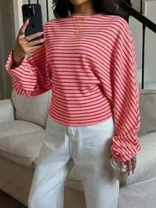 Close-up of pink and red striped batwing sleeve t-shirt with round neck