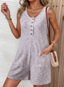 Detail shot of a casual waffle knit sleeveless romper featuring button-down V-neck