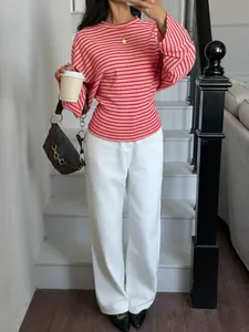 Close-up showing the stylish red and white striped pattern on a batwing long sleeve t-shirt