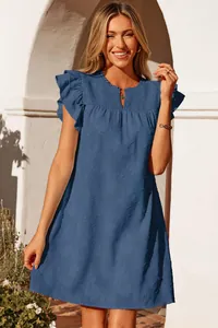 Detailed view of a blue V-neck summer dress featuring ruffled sleeves and floral embroidery texture