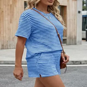 Close-up of blue and white striped texture on casual short sleeve and shorts set