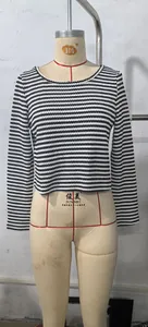 Detailed view of black and white striped long sleeve top with pineapple grid texture