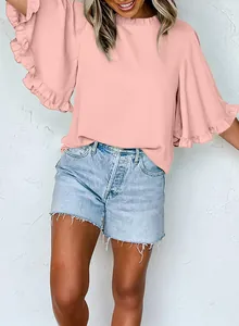 Close-up of pink round neck blouse with elegant ruffled half sleeves for summer