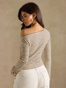 Back view of a chic brown and white striped off-the-shoulder long-sleeved ribbed t-shirt
