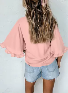 Back view of a stylish pink summer blouse with elegant ruffle sleeve details for women.