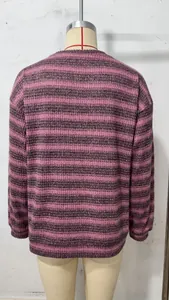 Back view of a stylish pink and grey striped oversized crew neck waffle knit sweatshirt
