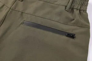 Detail view of men's cargo shorts with elastic waist and waterproof zipper pocket