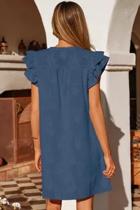 Rear view of a stylish blue summer dress featuring double ruffle sleeves and floral jacquard texture