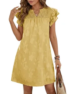 Close-up detail of yellow V-neck summer dress with ruffled sleeves and floral jacquard pattern
