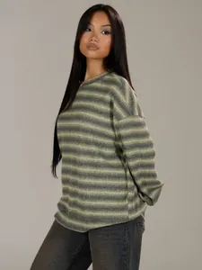 Detailed profile view of a stylish oversized striped sweatshirt on an Asian model