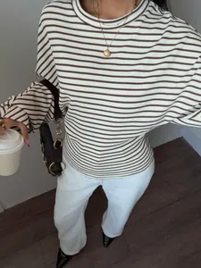 Close-up of a striped batwing sleeve t-shirt showing the ribbed texture and fit.
