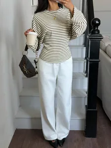 Detail view of a chic striped batwing sleeve t-shirt with a classic crew neck.