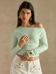 Detailed shot of a woman wearing a green striped off-the-shoulder long sleeve T-shirt