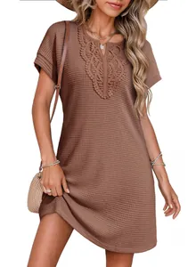 Detail of brown waffle knit dress with intricate lace V-neck and short sleeves