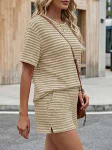 Street style detail of a striped knit short sleeve top and matching split shorts set