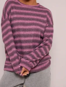 Detailed view of a purple striped oversized crewneck sweatshirt with soft fabric texture