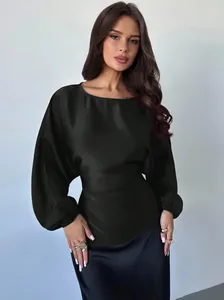 Close-up view of the elegant black satin long sleeve batwing blouse for women in autumn.