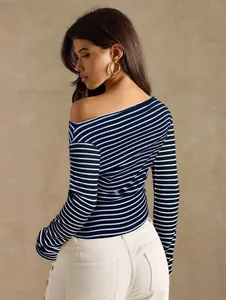 Back view of a striped off-the-shoulder long sleeve shirt with navy and white stripes