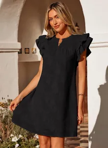 Detail of black V-neck summer dress with ruffle sleeves and textured floral pattern.