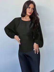 Detailed view of an elegant black satin long sleeve blouse with lantern sleeves