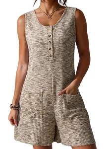 Detailed macro view of waffle knit fabric and button design on women's sleeveless romper