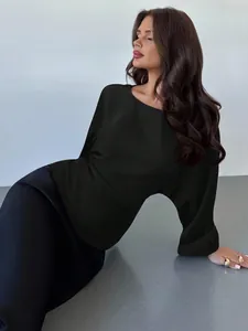 Close-up of elegant black satin long sleeve batwing blouse for autumn