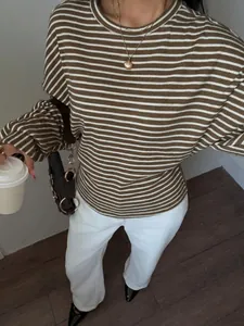 Detail of women's brown and white striped long-sleeve T-shirt with batwing sleeves