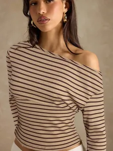 Detailed view of women's elegant off-the-shoulder striped knit long sleeve T-shirt