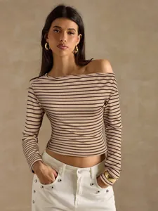 Detail of a chic striped off-the-shoulder long-sleeve top in a soft beige tone