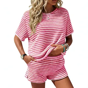 Casual women's pink striped two-piece set with crew neck top and side slit shorts