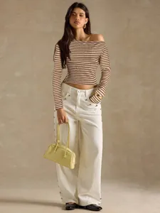 Chic striped off-the-shoulder long sleeve knit top paired with white wide leg trousers