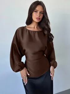 Close-up view of elegant coffee-colored satin blouse with lantern sleeves