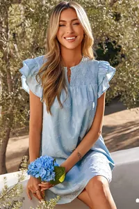 Light blue V-neck ruffled sleeve smocked floral mini dress worn by a model