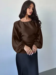 Close-up view of elegant brown satin lantern sleeve blouse with waist tie design