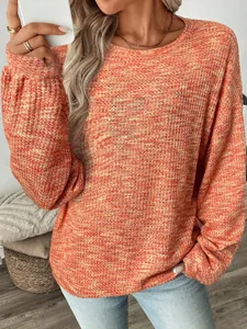 Close-up detail of women's vibrant orange colorful waffle knit loose long sleeve T-shirt
