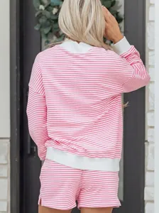 Back view of a cozy pink and white striped cotton sweatshirt and matching shorts loungewear set