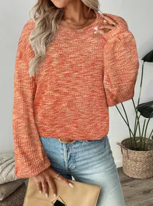 Detail view of vibrant orange waffle knit fabric on a stylish long sleeve shirt