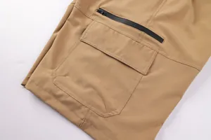 Close-up of khaki cargo shorts with functional zipper and side pocket details