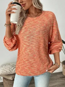 Model wearing a vibrant orange waffle knit long-sleeved shirt with a relaxed fit