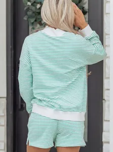 Back view of mint green and white striped oversized cotton sweatshirt and shorts set.