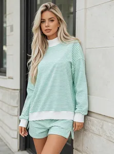 Fashionable close-up of mint green striped oversized cotton sweatshirt and shorts
