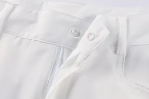 Detail of the fly and snap button closure on white men's functional cargo shorts