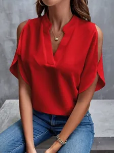 Detail view of a vibrant red V-neck cold-shoulder chiffon blouse on a model