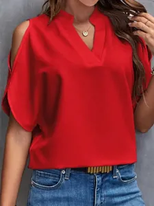 Detail view of a bright red V-neck chiffon blouse with stylish cold shoulder cutouts