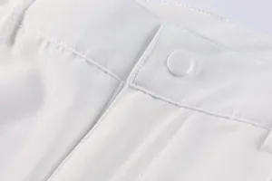 Detailed close-up showing button and stitching on white men's functional cargo shorts