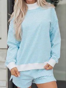 Detailed view of women's blue and white striped oversized sweatshirt and shorts