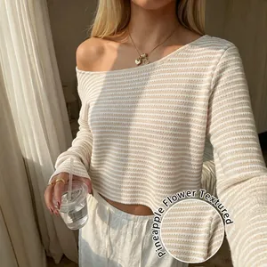 Cozy beige striped long-sleeve knit top featuring a unique pineapple flower texture