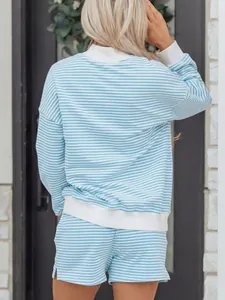 Back view of a blue and white striped oversized sweatshirt and shorts set for women