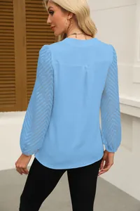 Back view of light blue chiffon blouse featuring elegant chevron lace patchwork sleeves
