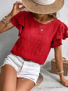 Close-up detail of women's red textured top featuring elegant double ruffle sleeves.
